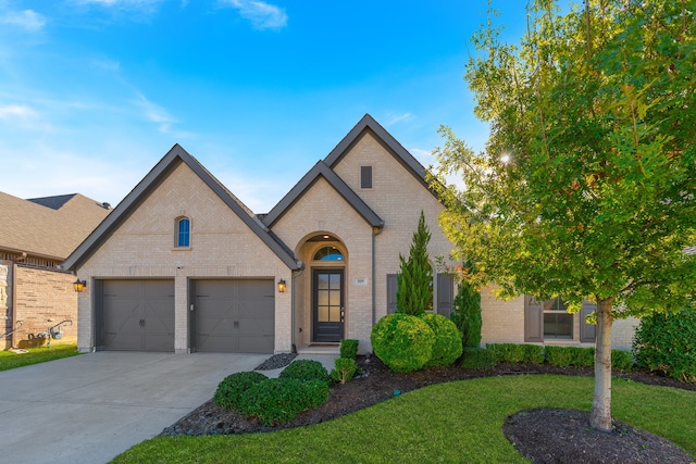 french provincial home with a front yard