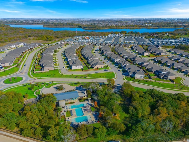 309 Cowling Dr, Little Elm, TX 75068 - aerial overview of property's location with a large body of water, nearby suburban area, and a pool area
