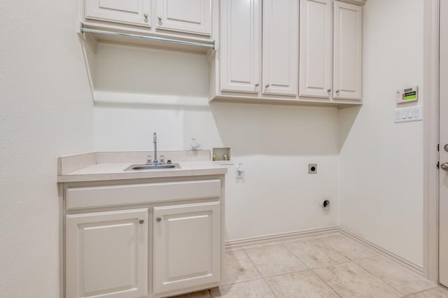 laundry room with sink, cabinets, electric dryer hookup, hookup for a washing machine, and light tile patterned floors