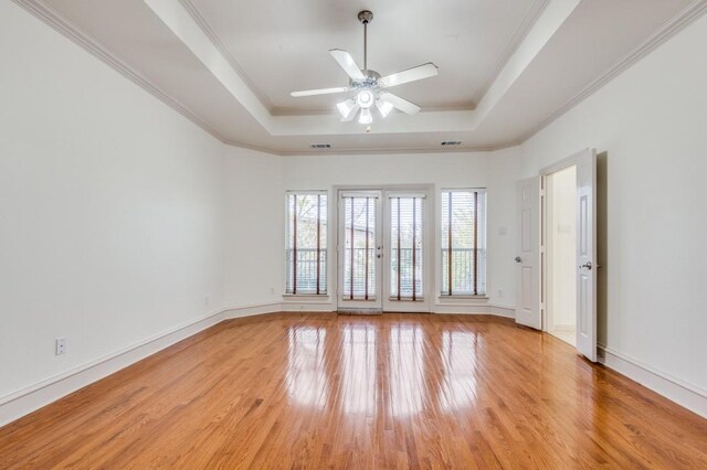 corridor featuring crown molding and light hardwood / wood-style floors