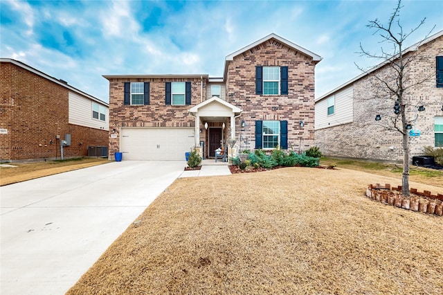 traditional home featuring driveway, brick siding, central AC unit, an attached garage, and a front yard