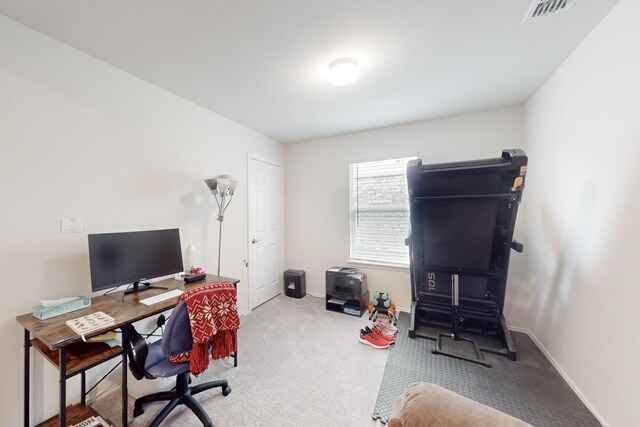 office featuring carpet, visible vents, and baseboards