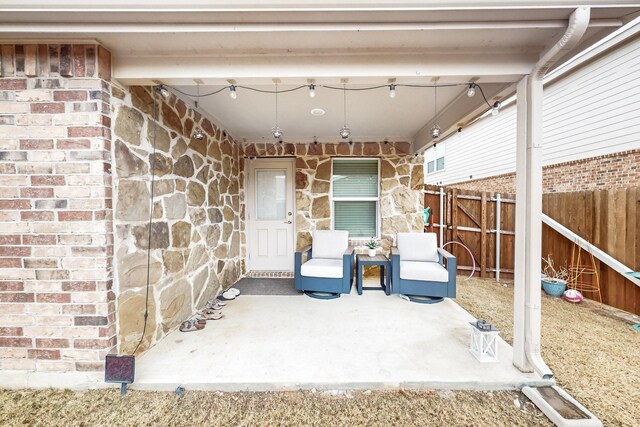 view of patio / terrace featuring fence