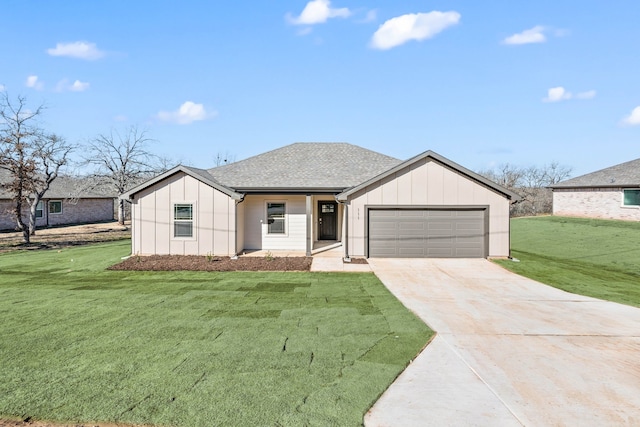 view of front of house featuring a garage and a front yard