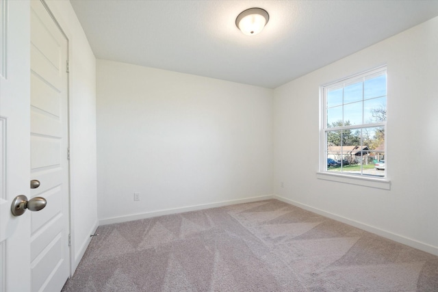 unfurnished room with carpet flooring