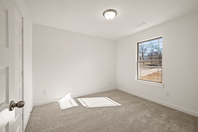 spare room featuring carpet