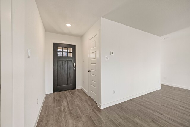 unfurnished living room with ceiling fan and dark hardwood / wood-style flooring