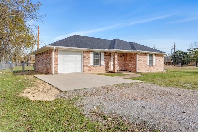 single story home featuring a garage and a front lawn