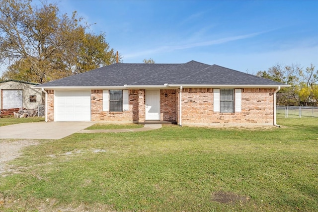 ranch-style house featuring a front lawn and a garage