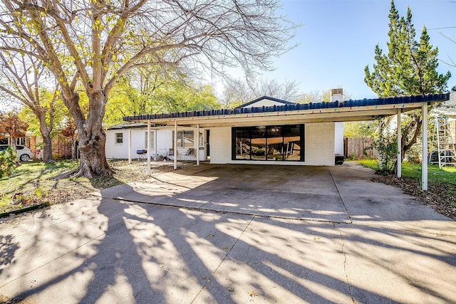 view of front of home featuring a carport