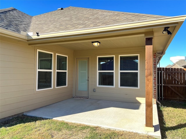 entrance to property featuring a patio