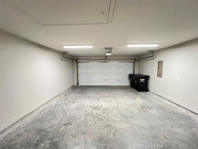 garage with electric panel and a garage door opener