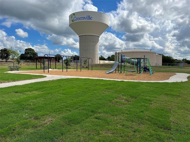 view of play area featuring a lawn