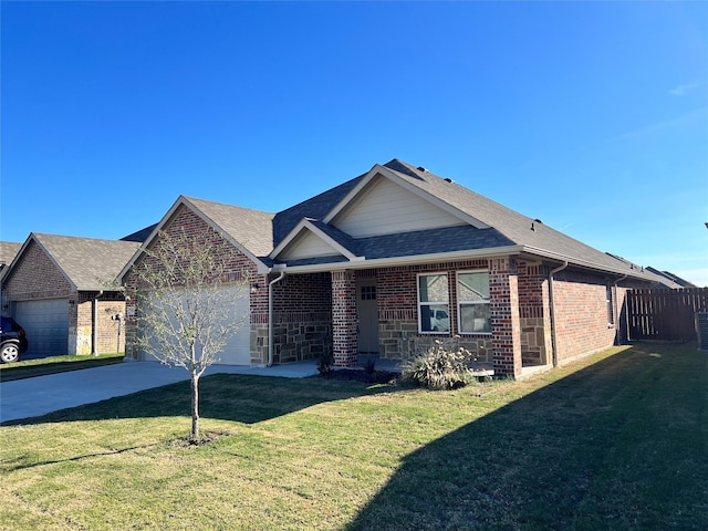 view of front of home featuring a garage and a front yard