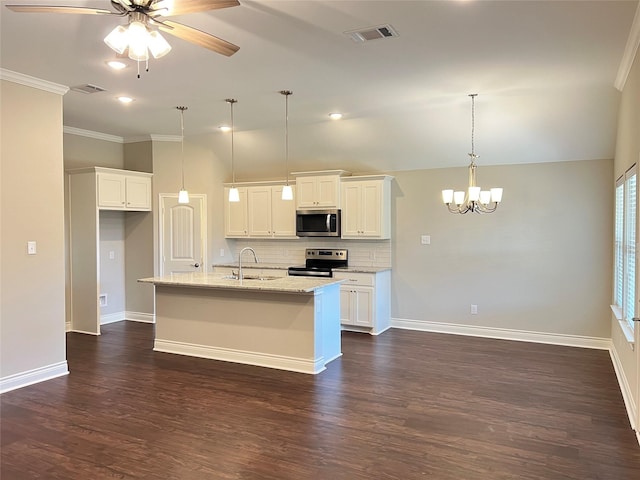 kitchen with stainless steel appliances, white cabinetry, and dark wood-type flooring