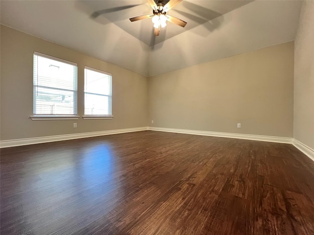 unfurnished room featuring ceiling fan, dark hardwood / wood-style flooring, and lofted ceiling