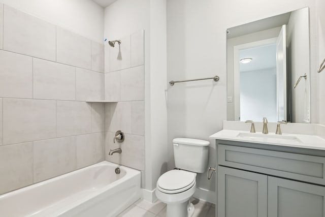 full bathroom featuring tile patterned floors, vanity, toilet, and tiled shower / bath