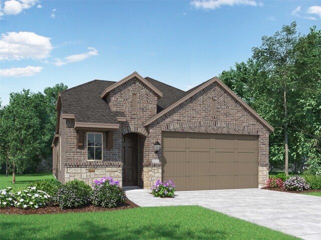 french provincial home featuring a front yard and a garage