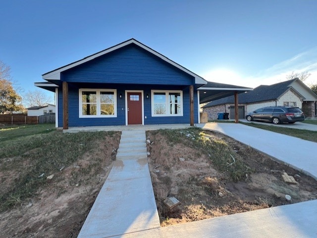 view of front of property featuring a carport