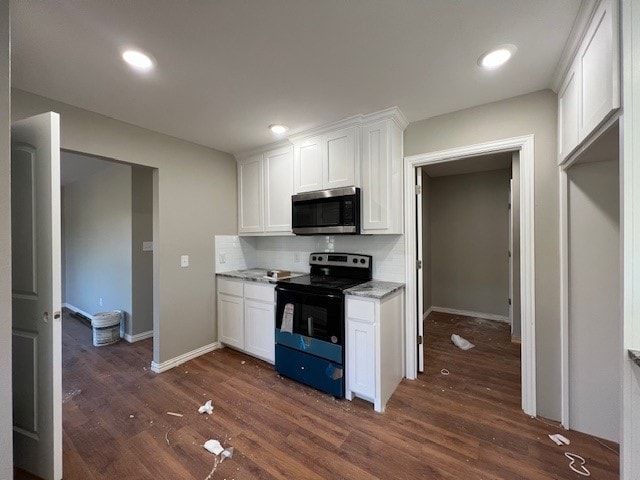 kitchen featuring white cabinets, black range with electric cooktop, dark hardwood / wood-style floors, and light stone countertops