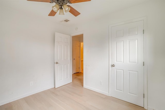 unfurnished bedroom featuring ceiling fan and light hardwood / wood-style flooring