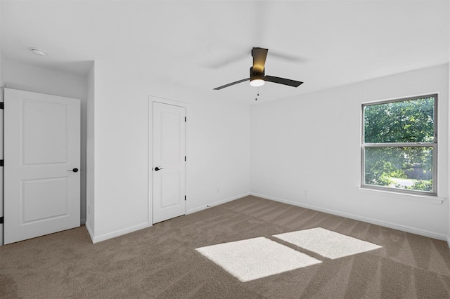 unfurnished bedroom featuring ceiling fan and carpet flooring