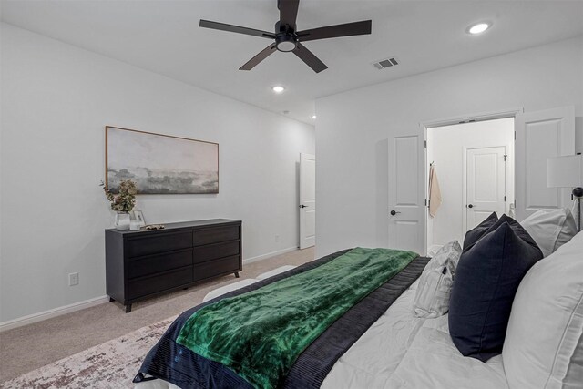 bedroom featuring ceiling fan and light carpet