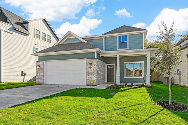 view of front of property with a garage and a front lawn