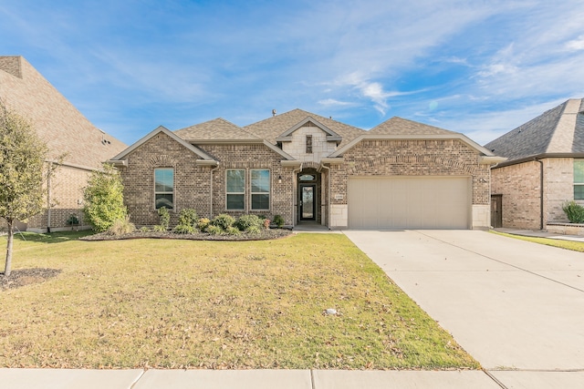 view of front of home featuring a garage and a front yard