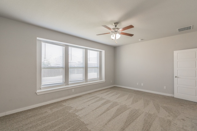 unfurnished room featuring carpet flooring and ceiling fan