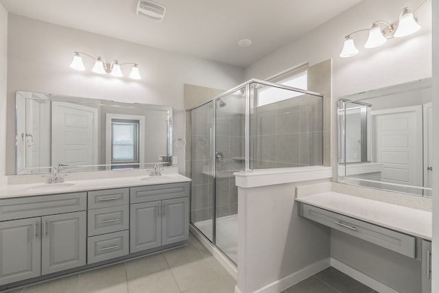 bathroom featuring tile patterned floors, vanity, and an enclosed shower