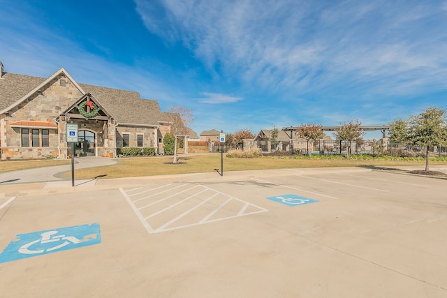 view of car parking with a yard