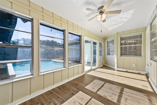 unfurnished sunroom with ceiling fan, lofted ceiling, and a wealth of natural light