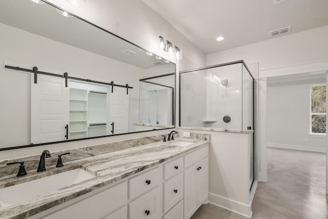 bathroom with vanity, walk in shower, and concrete floors