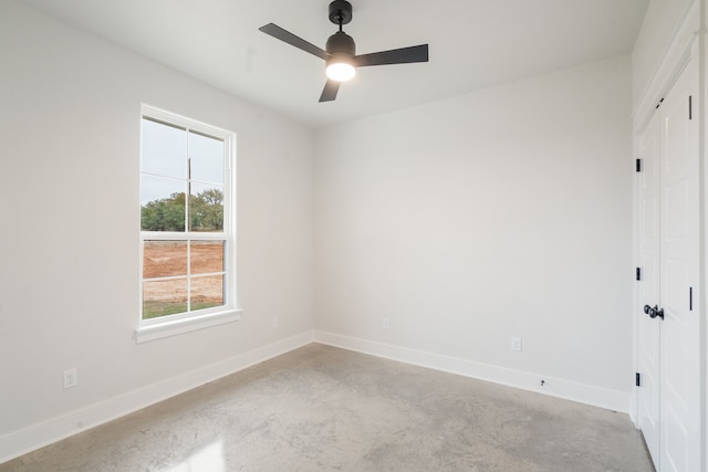 unfurnished room with ceiling fan and light colored carpet