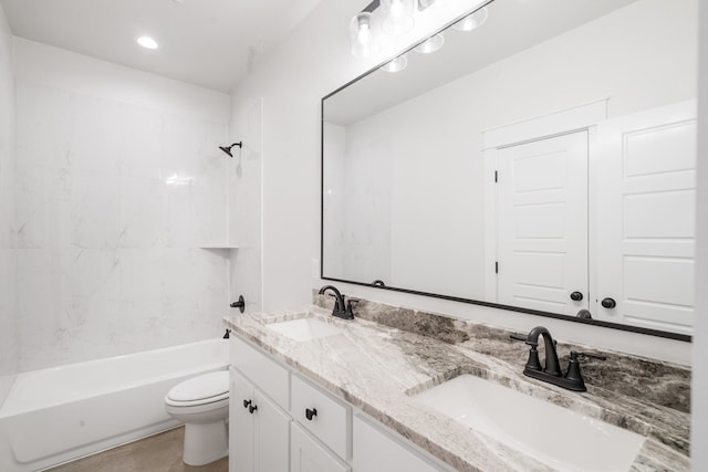 full bathroom featuring vanity, toilet, and tiled shower / bath