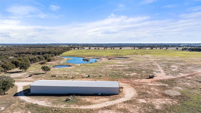 drone / aerial view with a rural view and a water view