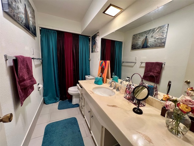 bathroom with vanity, tile patterned floors, and toilet