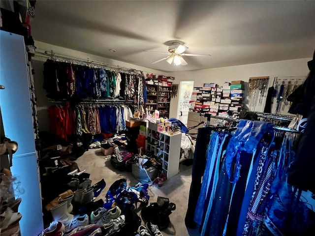 walk in closet featuring ceiling fan