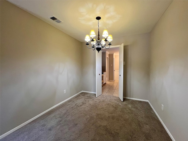 unfurnished room with light carpet and a chandelier