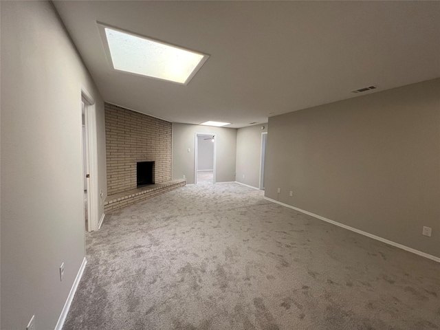 basement with a brick fireplace and carpet floors