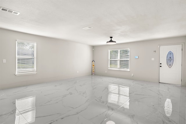 interior space featuring a textured ceiling