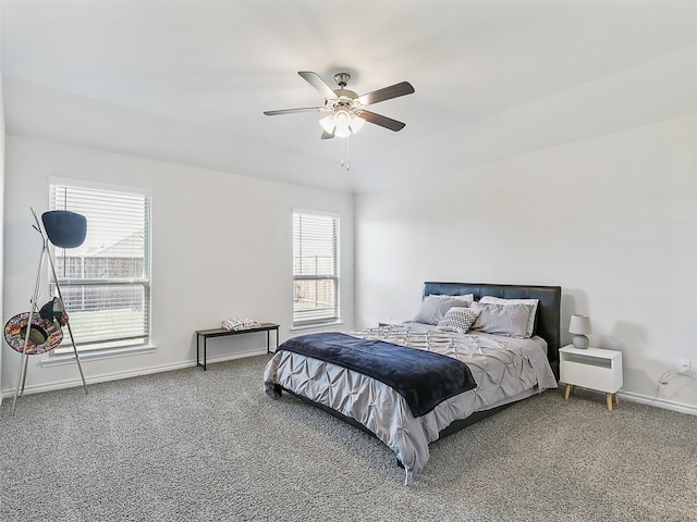 bedroom with ceiling fan and carpet