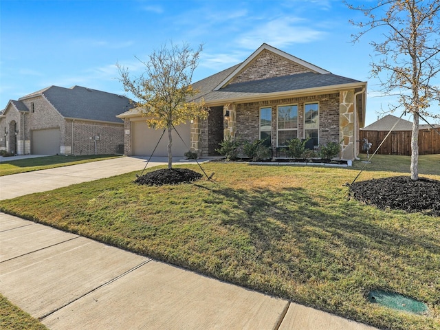 ranch-style home with a garage and a front yard