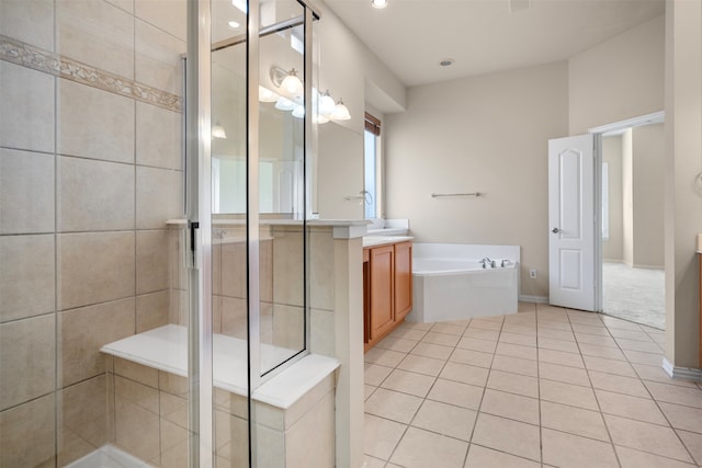 bathroom featuring tile patterned floors, vanity, and separate shower and tub