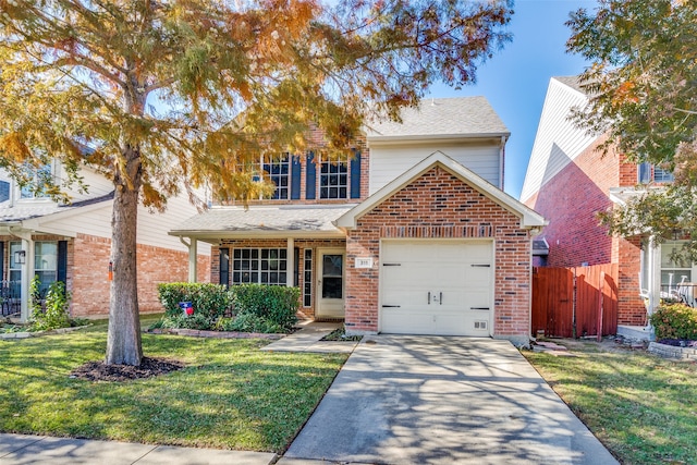 view of front property with a garage and a front lawn