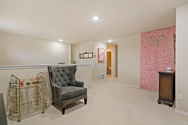 living area featuring carpet flooring, recessed lighting, visible vents, and baseboards