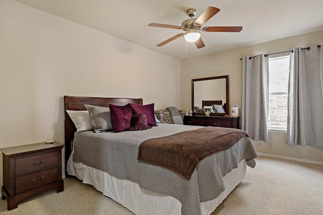 bedroom with baseboards, light carpet, and a ceiling fan