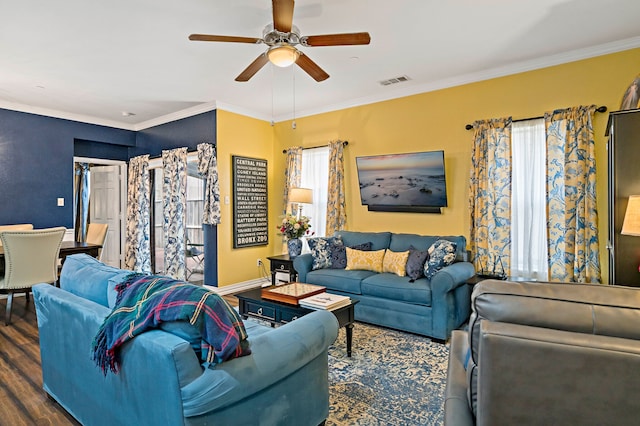 living room featuring crown molding, ceiling fan, and dark wood-type flooring