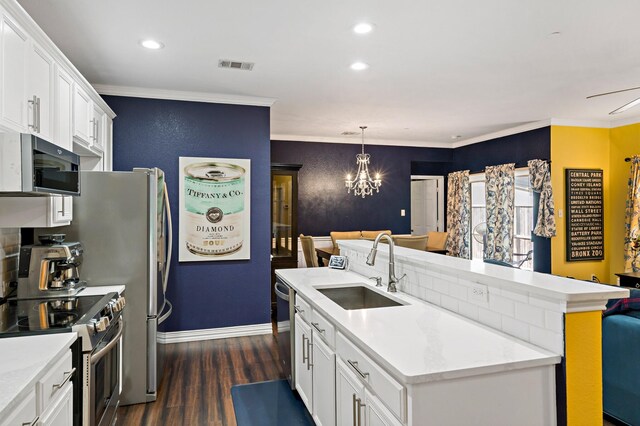 kitchen featuring crown molding, sink, white cabinets, and appliances with stainless steel finishes